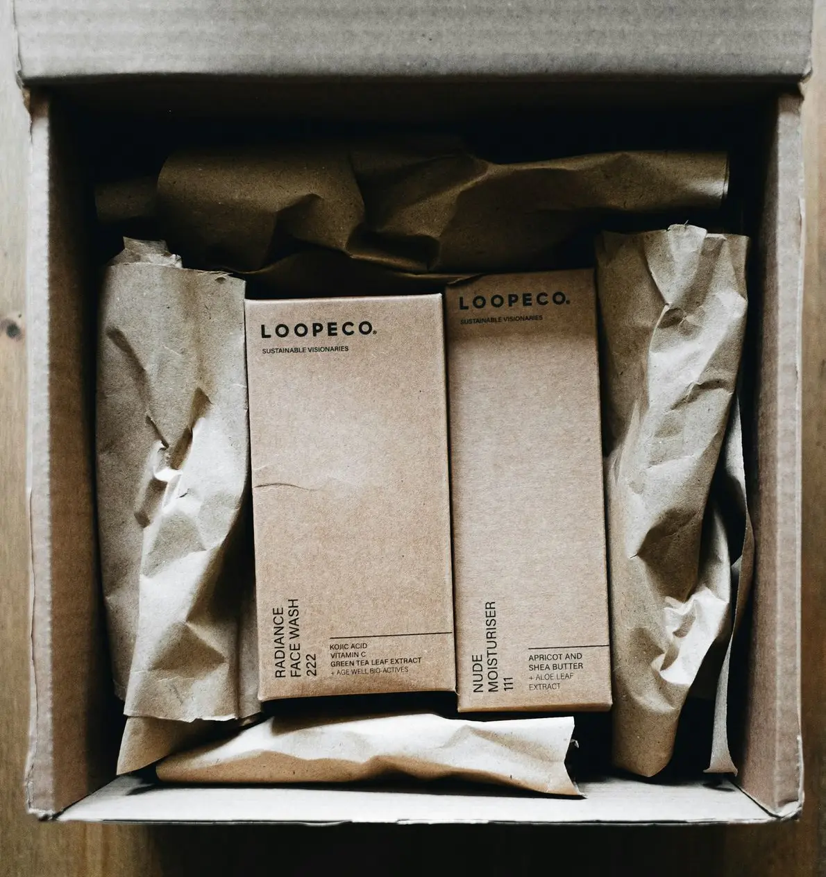 a box with three books inside of it